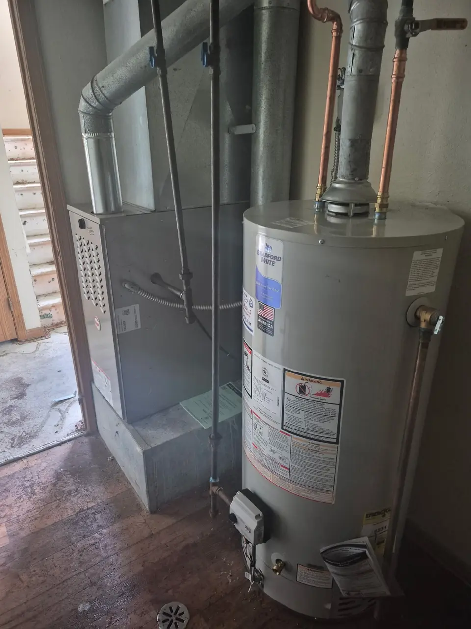 Gas furnace and evaporator coil in a basement
