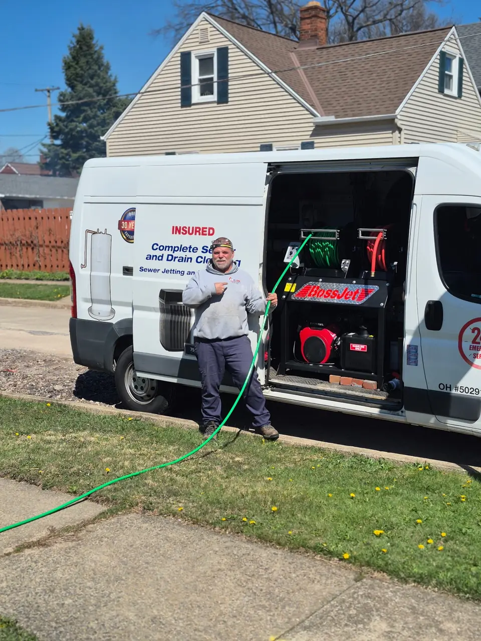 All-Pro sewer jetter rig and jetting hose staged at a home in the Cleveland suburbs